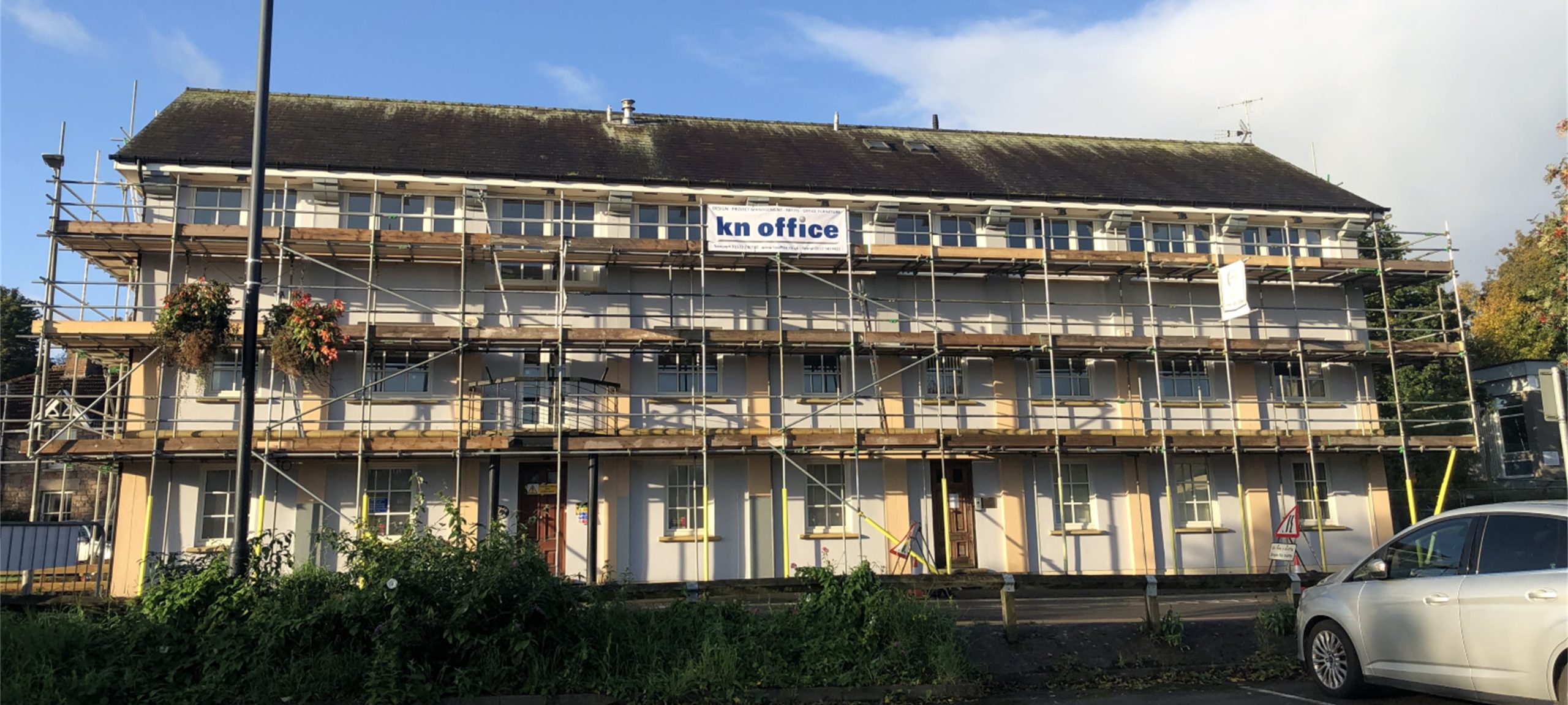 Scaffolding up for render repair, new glass for blown glass units and a fresh coat of paint